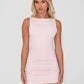 Model wearing sleeveless bodycon mini dress in light baby pink.