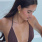Close up of brunette girl in espresso brown thong bikini.
